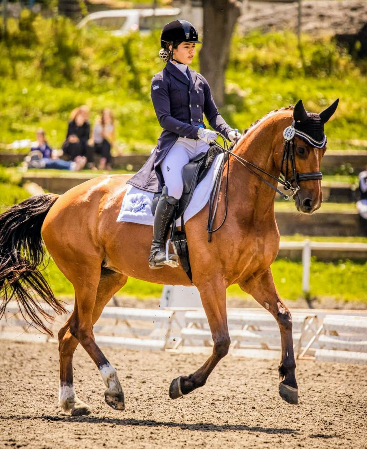 Mika Barel competing on her bay horse